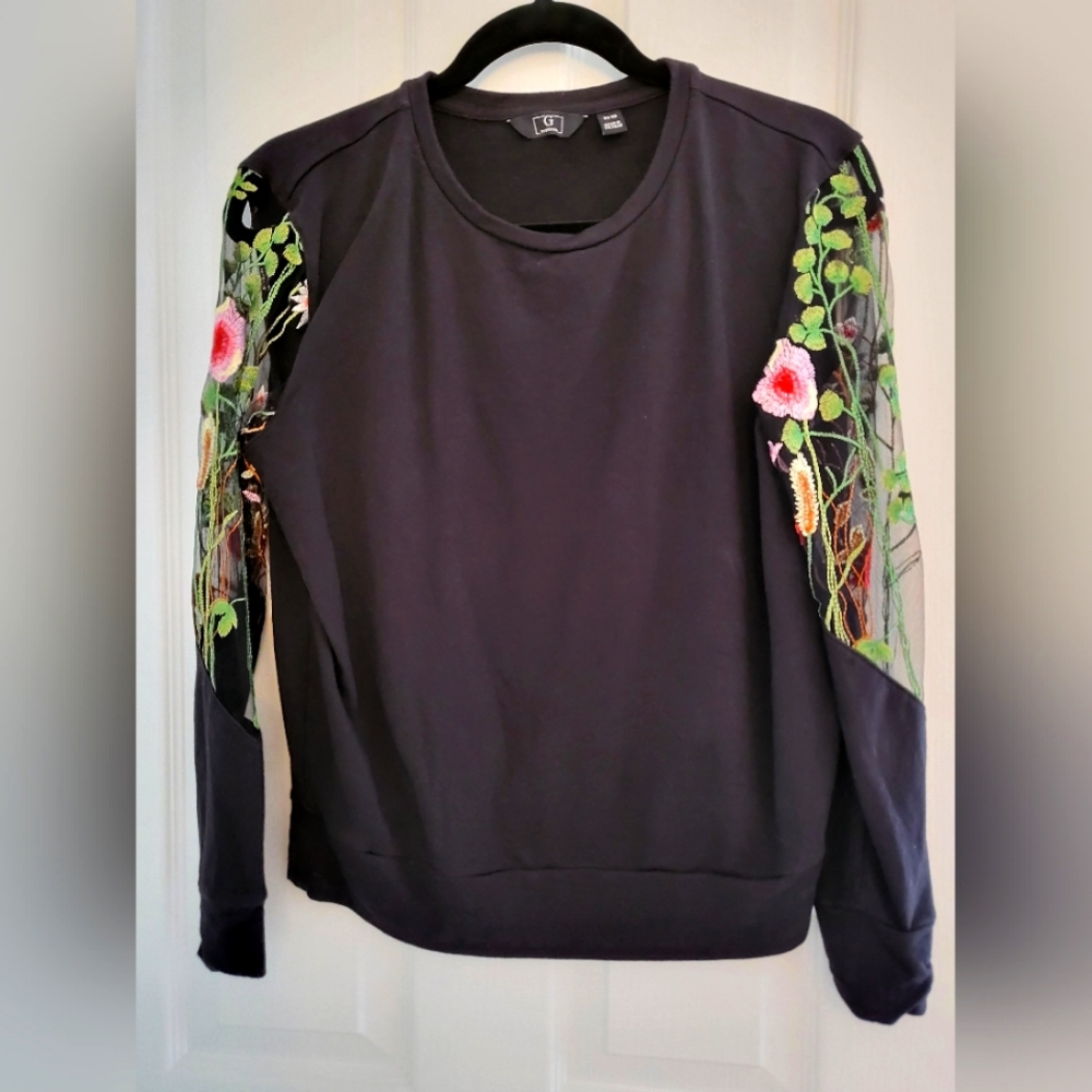 Black blouse with see-through embroidered flower sleeves